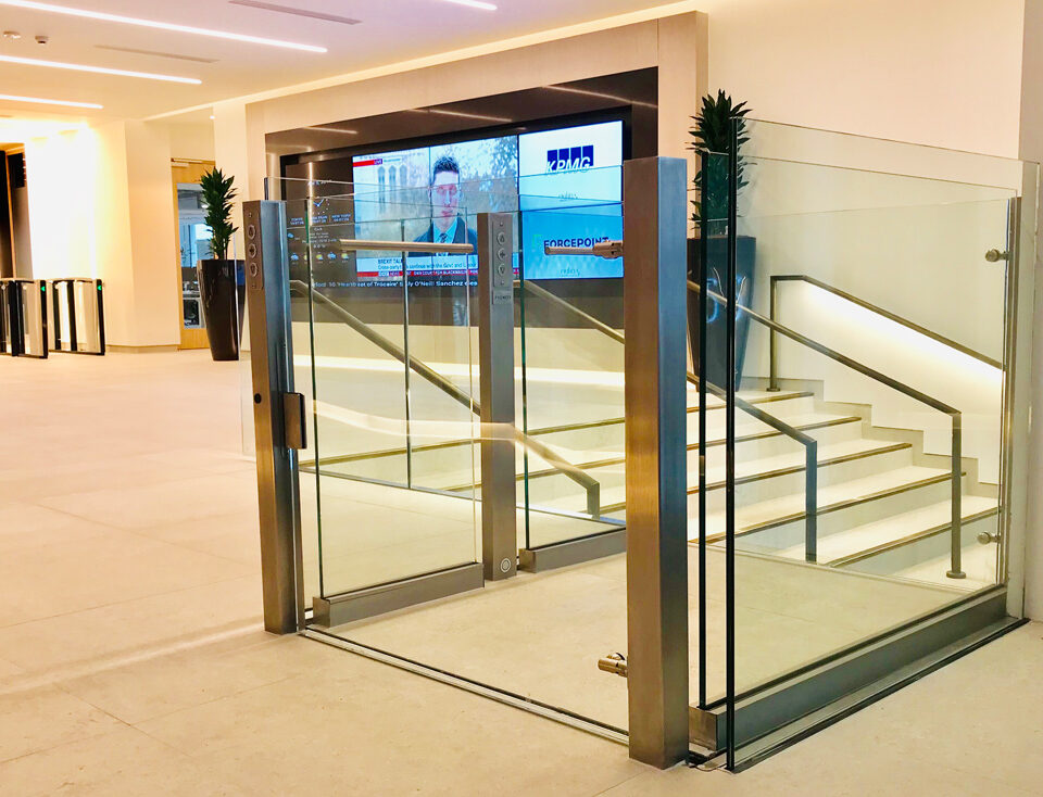Modern Lyfthaus platform lift with glass and steel, integrated into a bright office lobby.